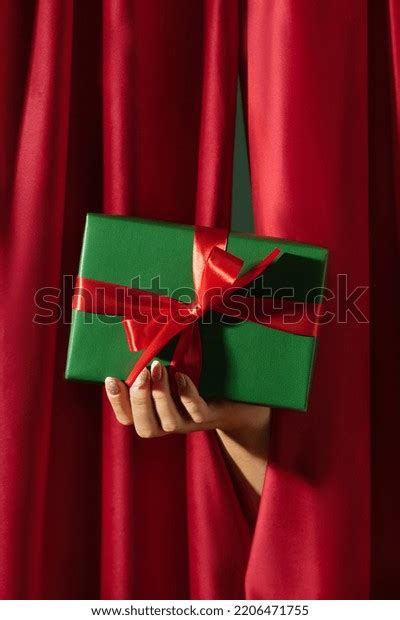 Hand Giving Gift Box Over Red Stock Photo 2206471755 Shutterstock