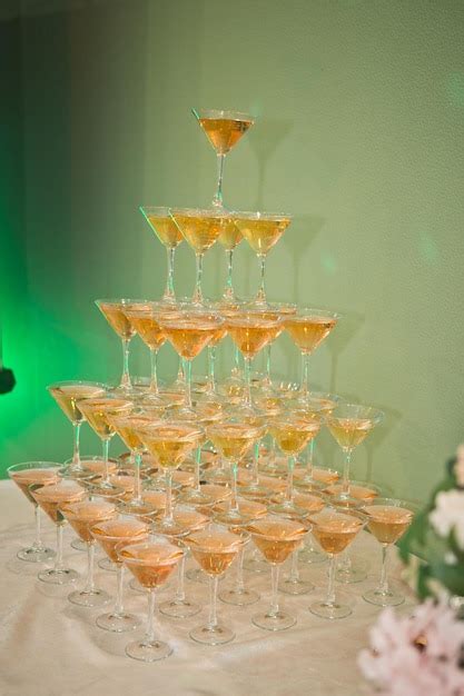 Premium Photo A Tall Mound Of Champagne At A Wedding Banquet 2642