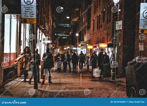 Shoppers Walking on the Street at Night Editorial Stock Image - Image ...