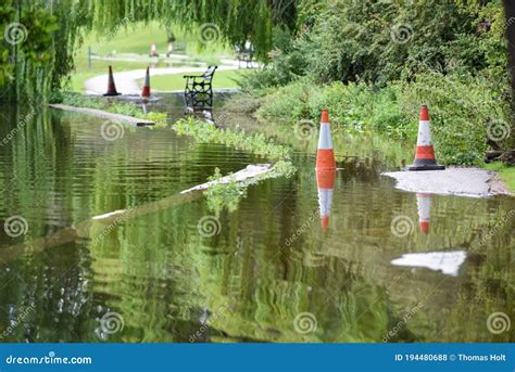 Flood Water Overflows From A Lake During Flooding After Heavy Rain And