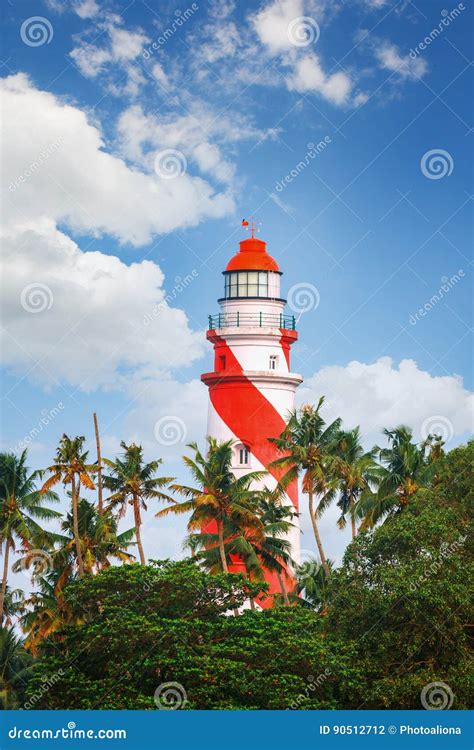 Thangassery Lighthouse on the Cliff Surrounded by Palm Trees and Big Sea Waves on the Kollam ...