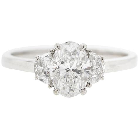 East West Oval Diamond Engagement Ring In A Three Stone Setting At