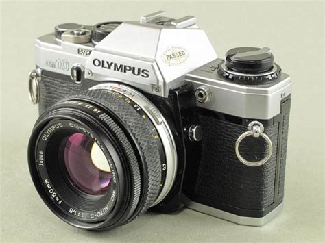 Olympus OM10 set with lenses and accessories - Catawiki