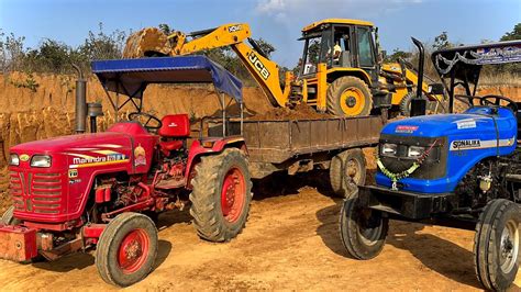 Jcb Dx Backhoe Loading Mud In Mahindra Di And Sonalika Di Tractor