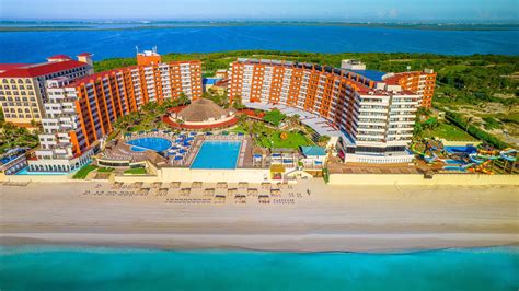 Aerial view of hotel with pool and landscape at Crown Paradise Club Cancun