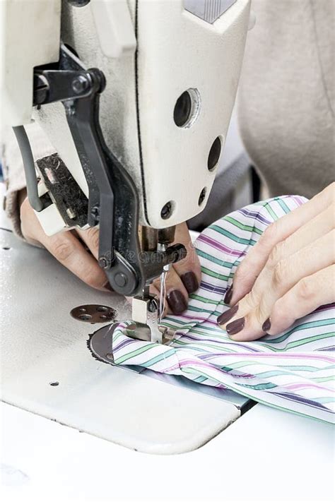 Industrial Sewing Machines With Sewing Machine Operator Stock Image