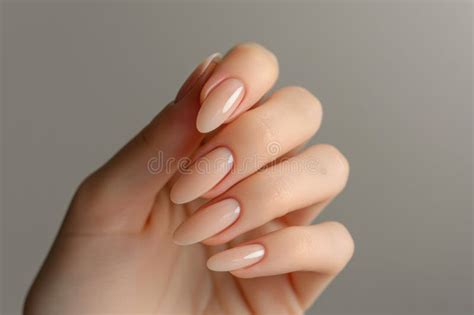 Closeup To Woman Hands With Elegant Neutral Colors Manicure Beautiful Nude Manicure On Long