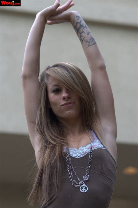 Amateur Babe With Arm Tattoos Poses Seductively Outdoors For The Camera Photos