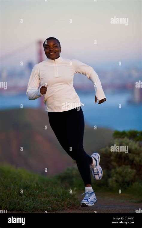 USA California San Francisco Woman Jogging Golden Gate Bridge In