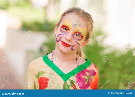 Happy Little Girl with Face Art Paint in the Park. Stock Photo - Image ...