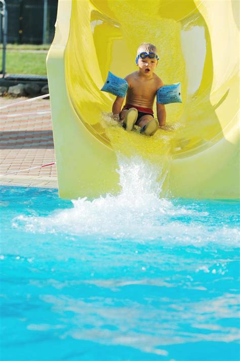 water slide fun on outdoor pool 11613686 Stock Photo at Vecteezy