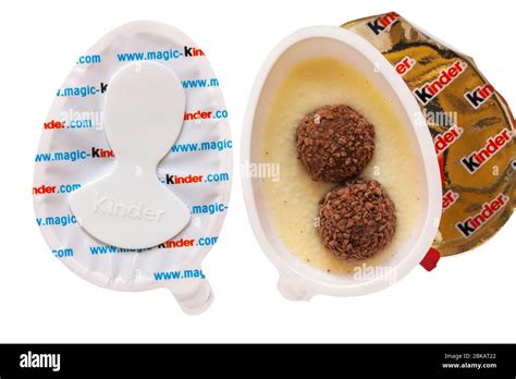 Kinder Joy Egg With Surprise Showing Both Halves With One Opened To