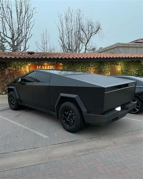 Back Of Matte Black Cybertruck In 2024 Tesla Sports Car Blacked Out