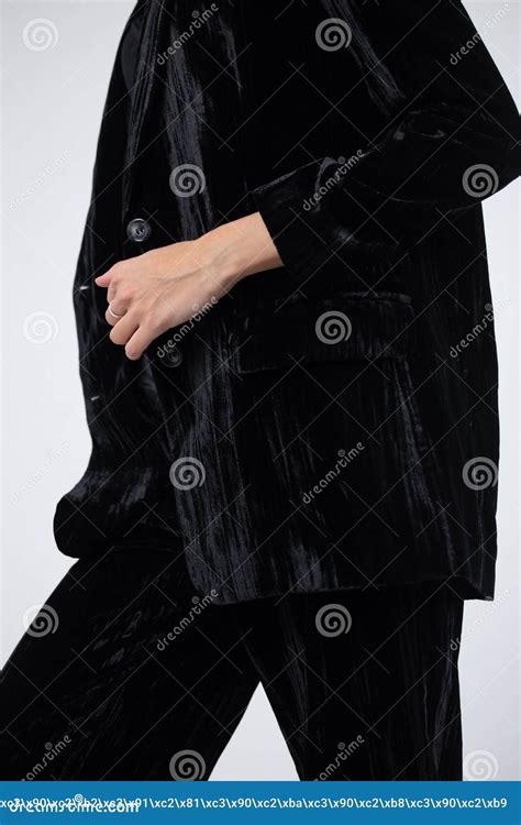 A Girl Without A Face In A Black Suit On A White Background Close Up