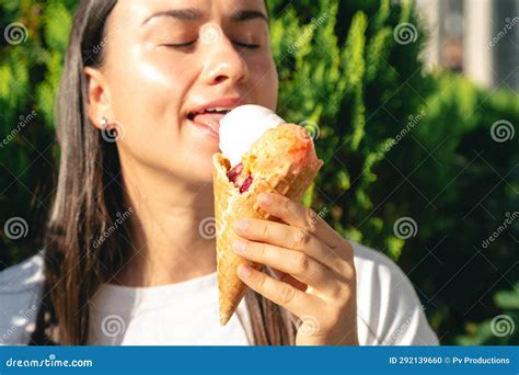 Portrait Of Happy Caucasian Brunette Woman Eating Ice Cream Cone Stock Photo Image Of Cute