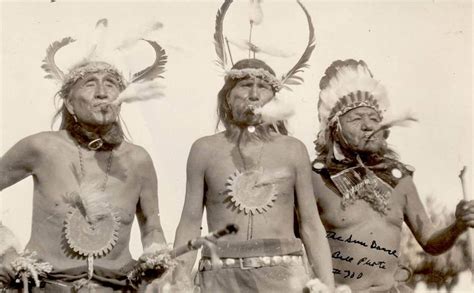 Shoshoni Men In Feather Headdresses Blow Eagle Bone Whistles As Part Of A Sun Dance In Fo