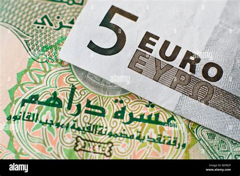 5 Euro Note On Top Of A United Arab Emirates 10 Dirhams Banknote