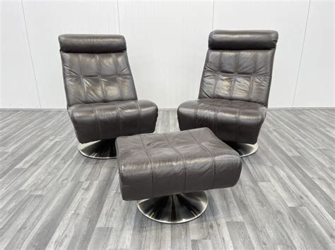 Pair Of Dark Brown Violino Italian Leather Swivel Chairs And Footstool