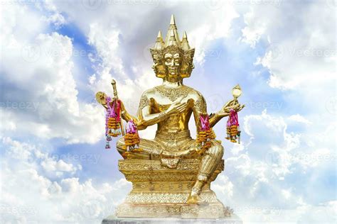 Golden Of Brahma Statue Religious With Blue Sky With White Spindrift