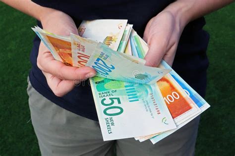 Harish, Israel - October 14 2020: Two Woman Hands Counting Many Israel Shekel Banknotes. Stock ...