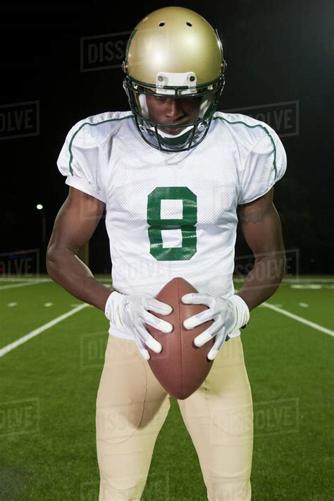 Football Player Holding Ball Portrait Stock Photo Dissolve