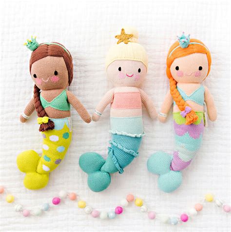 Hand-crafted Cuddle + Kind dolls giving meals to kids in need