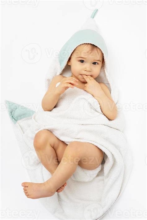 Cute Baby Wrapped Into Hooded Towel After A Bathing 16233910 Stock