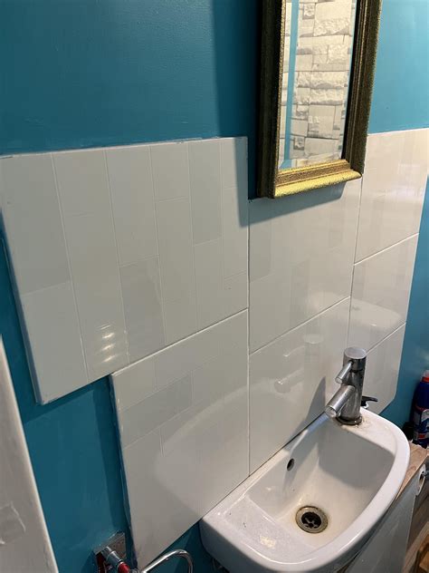 Can I remove these tiles without ruining the wall or would I have to re