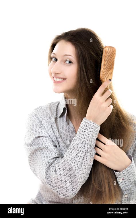 Beautiful Young Girl Taking Care Combing Her Long Straight Hair