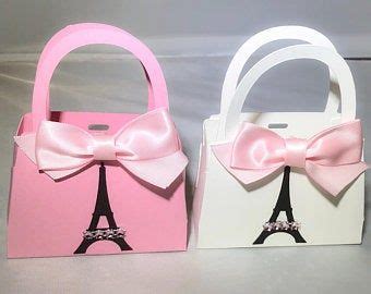 Two Paper Bags With Bows And The Eiffel Tower In Pink White And Black