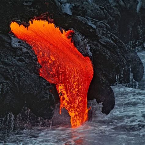 an orange substance is coming out of the water