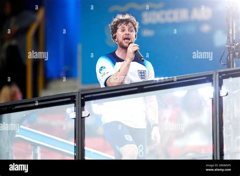 England's Tom Grennan performs at half time during Soccer Aid for ...