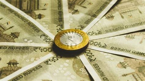 Rupee Gains Paise To Close At Against Us Dollar Market News