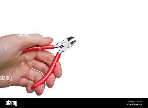 Cropped Image Of Hand Holding Pliers Over White Background Stock Photo