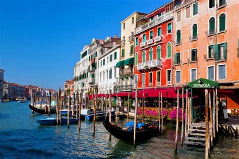 Venice Italy Gondola Floats On A Canal Among Old Venetian