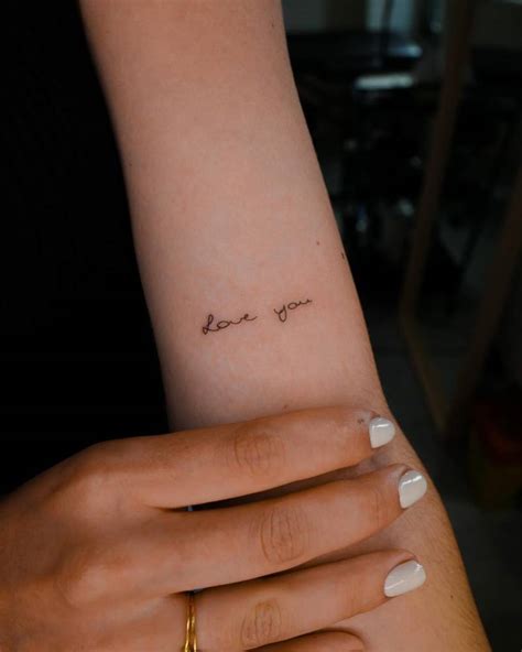 Handwritten Love You Lettering Tattoo Placed On The