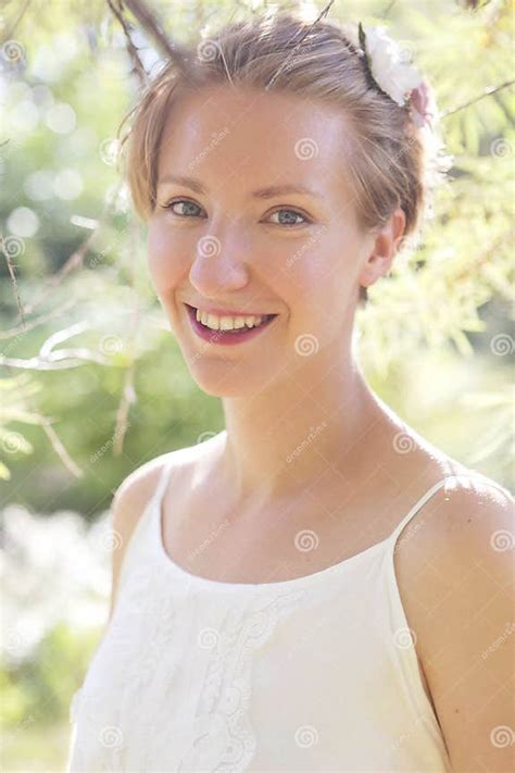 Cute Happy Caucasian Woman With Short Haircut In White Dress In Stock