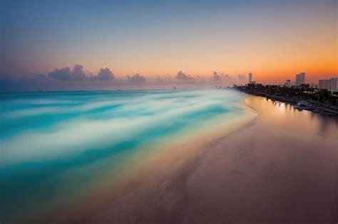 Premium AI Image | Sunset In A beautiful beach. Calm Sea