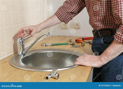 Kitchen tap installation stock photo. Image of working - 22103562