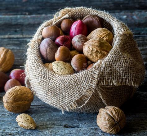 A Close Up Of A Burlap Sack Full Of Whole Nuts Stock Image Image Of