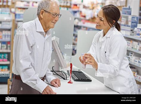 Making Prescriptions Simple Shot Of A Young Pharmacist Helping An