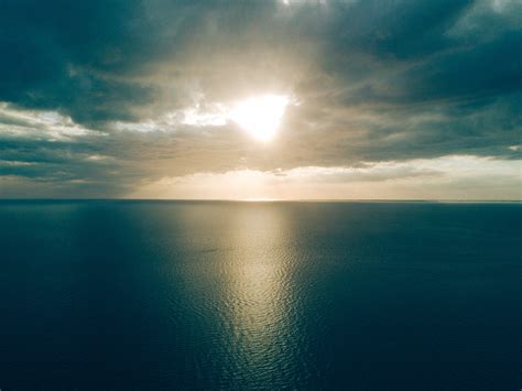 Lightning over Sea Against Storm Clouds · Free Stock Photo