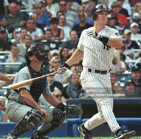 New York Yankees Tino Martinez watches as his two-run home run sails