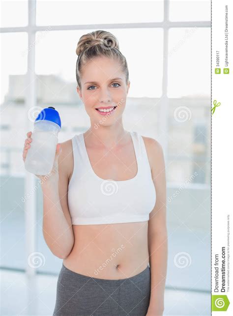 Smiling Sporty Blonde Holding Flask Stock Image Image Of Tied Person