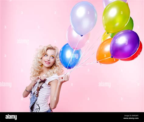 Portrait Of Beautiful Blonde Girl With Balloons Celebrating Birthday