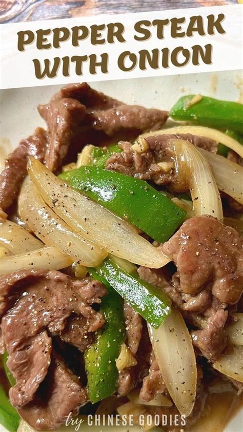 A White Plate Topped With Beef And Onions Next To Green Peppers On Top