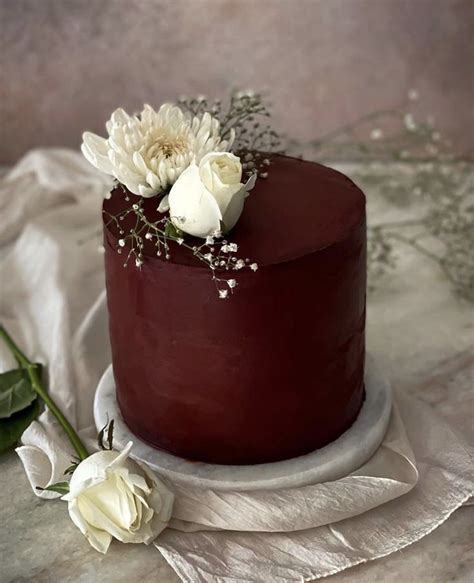 Elegant Red Wedding Cake with White Flowers