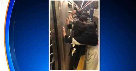 Passengers Shove Subway Car To Free Fellow Riders Trapped Luggage