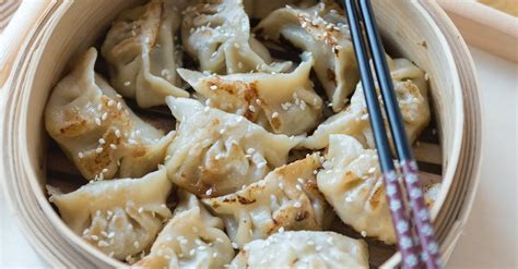 Traditional Dumplings with Chopsticks on Tray · Free Stock Photo