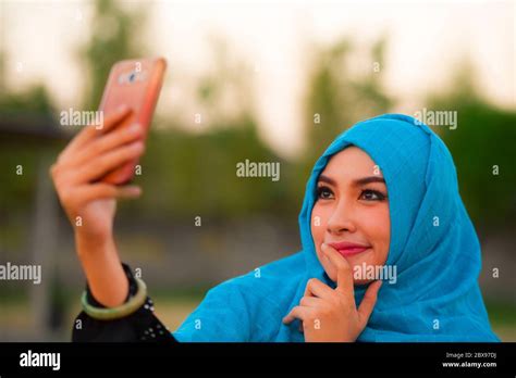 Lifestyle Portrait Of Young Happy And Beautiful Tourist Woman In Muslim